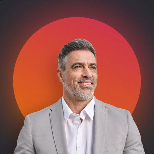 man in business attire smiling
